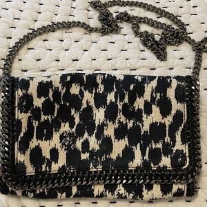 Falabella extra small crossbody bag in black and white print.